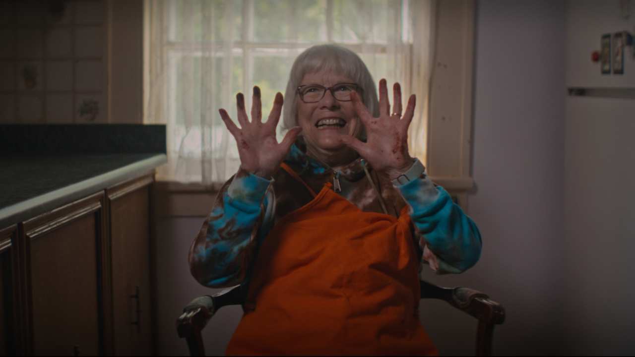 a woman holding her hands up in the air